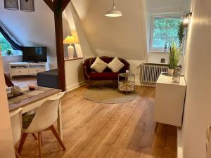 a living room with a couch and a table at Haus Heidetal in Bispingen