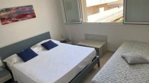 Posteľ alebo postele v izbe v ubytovaní Residence Romeo