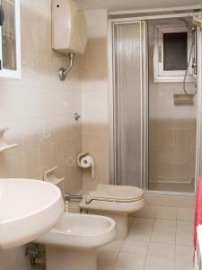 a bathroom with a toilet and a sink and a shower at Bed & Breakfast La Rosa dei Venti in Genova