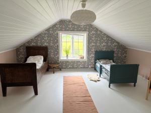 Postel nebo postele na pokoji v ubytování Farm stay at Løkka farm + 10 fotografií