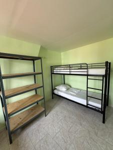 a room with two bunk beds in a room at Hostel Wilson in Saint-Denis