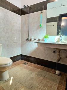 a bathroom with a sink and a toilet at 4 Bedroom Holiday Home In Bahria Town Phase 3 in Rawalpindi