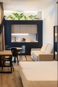 a living room with a couch and a table at Cool Lofts Boutique Castellón in Castellón de la Plana