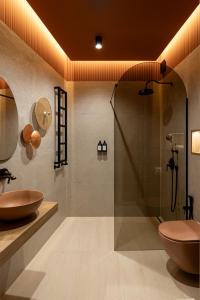a bathroom with a shower and a sink and a toilet at Chmielna 2025 Premium Apartment Wyspa Spichrzów in Gdańsk