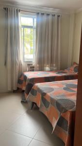 Postel nebo postele na pokoji v ubytování Apartamento Praia das Dunas Cabo Frio