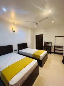 Jaffna City Palace Hotel客房内的一张或多张床位