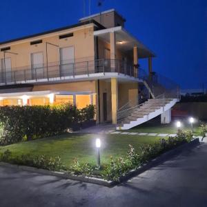 a large house with lights in front of it at Villa Luja in Arielli