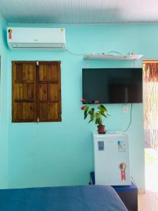 TV a/nebo společenská místnost v ubytování Pousada Villa Maria