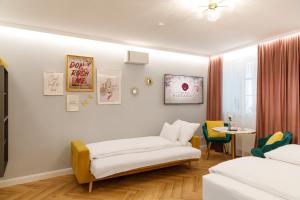 Postel nebo postele na pokoji v ubytování Vienna Hideaways - Boutique Stay with Secret Courtyard Access