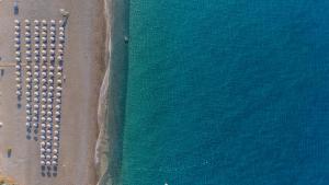 an aerial view of a beach and the ocean at Almyra Resort in Koutsounari