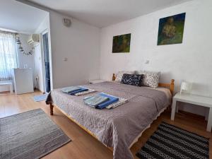 a bedroom with a large bed in a room at The Two Anchors in Nesebar