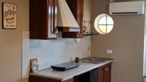 a kitchen with a sink and a counter top at Casa Vacanze Stefania in Maccarese