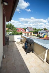 Balkón nebo terasa v ubytování Mazurskie Apartamenty