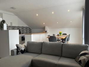 a living room with a couch and a table at Apartment Luvera in Ludbreg