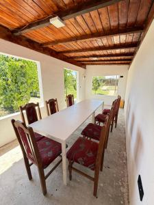 a dining room with a table and chairs at IsTh Wave House in Vadu