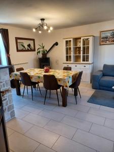 a dining room with a table and chairs at Casa Felice in Bale +4 photos