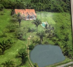 an aerial view of a house with a swimming pool at Chácara maria bonita in Rio Branco