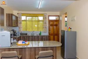 Kuchyň nebo kuchyňský kout v ubytování Lamuria Homes + 7 fotografií