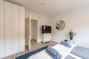 Μια τηλεόραση ή/και κέντρο ψυχαγωγίας στο Apartmenthaus in Neumünster