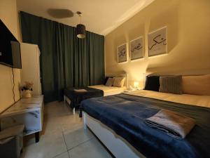 Letto o letti in una camera di TheGrid-HomeStay