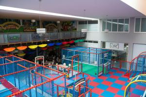 a large indoor play area with slides and rides at Hotel Saturday in Palma Campania