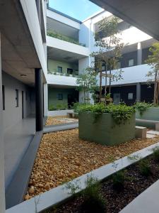 an external view of a building with a courtyard at 212 The Meadows in George