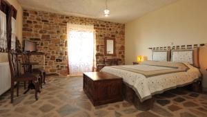 Postel nebo postele na pokoji v ubytování Ethaleia Hotel
