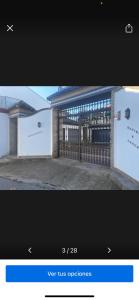 a picture of a building with a gate at Apartamentos Turisticos Ilusiones 2 in Cazalla de la Sierra