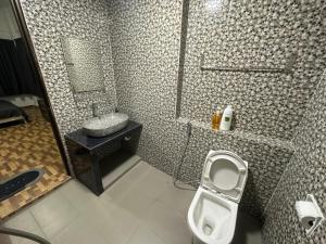 a bathroom with a toilet and a sink and a shower at PD Paradise Lagoon Apartment in Port Dickson +131 photos