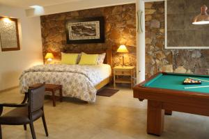 A bed or beds in a room at Casa Corazon de Plata Suites
