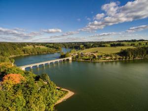 an aerial view of a river with a dam at Au Petit Pont de Champagne in Waimes +8 photos