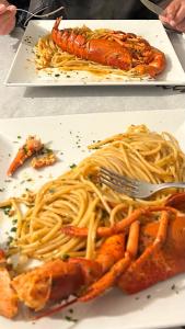 a plate of food with spaghetti and a fork at lemaree Torre dell orso Lecce in Torre dell'Orso