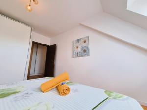 a bedroom with a bed with towels on it at Bucharest Central DD Apartment in Bucharest +16 photos