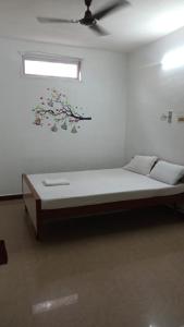 Postelja oz. postelje v sobi nastanitve Rajkumar GuestHouse