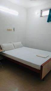 Postelja oz. postelje v sobi nastanitve Rajkumar GuestHouse