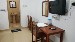 TV in/ali zabaviščno središče v nastanitvi Rajkumar GuestHouse