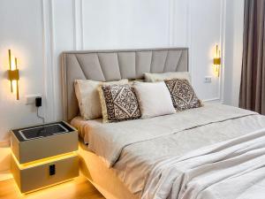 a bedroom with a bed with a sink on it at ЖК Millennium in Bishkek