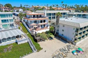 an aerial view of a house and a beach at Exclusive Beachfront Duplex in Carlsbad Village Ocean Views, Sleeps 9 in Carlsbad