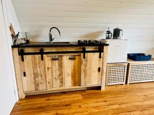 a kitchen with a sink and a counter top at Welcome to La Petite Ferme & Family in Carracastle +9 photos