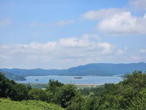 a view of a large body of water with mountains at geo campers lilu in Kutaisi