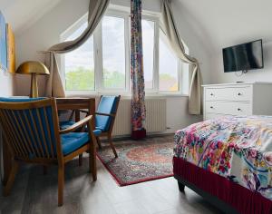 En eller flere senge i et værelse på Appartement Khodai