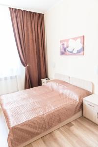 a bedroom with a bed and a window at Minihotel Freedom in Lviv