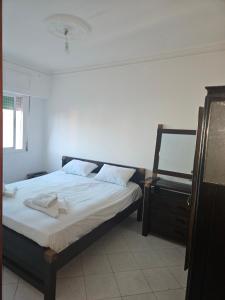 Ένα ή περισσότερα κρεβάτια σε δωμάτιο στο Résidence sarra