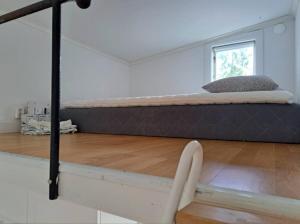 a bedroom with a bed in a room at Nature- & lakeside accommodation in Lerum