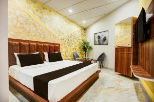 Ένα ή περισσότερα κρεβάτια σε δωμάτιο στο Hotel O Pankh