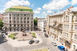 an aerial view of a city with buildings and cars at Minihotel Freedom in Lviv