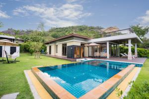 a house with a swimming pool in the yard at Ocean View Japandi Sauna & Rooftop 3BR Pool Villa in Khao Tao