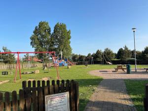 a park with a playground with at Disabled caravan -ramped decking - Grange Leisure Park, Mablethorpe - Pet friendly and Wifi - Meadow Lakes Caravan & Lodge Hire in Mablethorpe +3 photos
