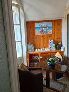 a living room with a table and a coffee table at Casa Vacanza Arzello in Melazzo