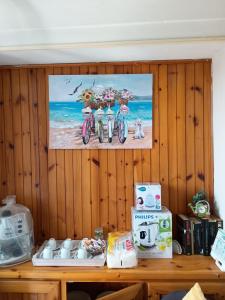 a wall with a picture of three bikes on it at Casa Vacanza Arzello in Melazzo